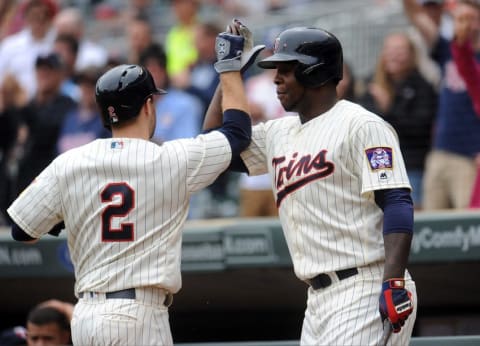 May 25, 2016; Minneapolis, MN, USA; Minnesota Twins second baseman Brian Dozier (2) is congratulated by Minnesota Twins right fielder Miguel Sano (22) on his home run during the first inning against the Kansas City Royals at Target Field. Mandatory Credit: Marilyn Indahl-USA TODAY Sports