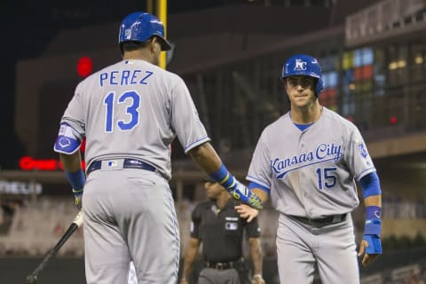 May 23, 2016; Minneapolis, MN, USA; Kansas City Royals third baseman Whit Merrifield (15) celebrates with catcher Salvador Perez (13) after scoring a run in the fourth inning against the Minnesota Twins at Target Field. Mandatory Credit: Jesse Johnson-USA TODAY Sports