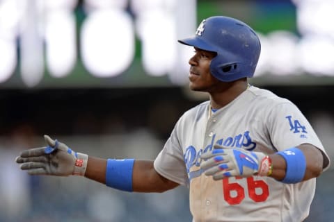 May 22, 2016; San Diego, CA, USA; Los Angeles Dodgers right fielder Yasiel Puig (66) reacts after hitting a two RBI single during the 17th inning against the San Diego Padres at Petco Park. Mandatory Credit: Jake Roth-USA TODAY Sports