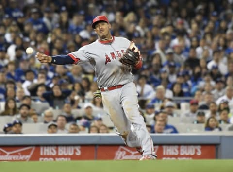 May 17, 2016; Los Angeles, CA, USA; Los Angeles Angels third baseman Yunel Escobar (6) throws to first base for an out against the Los Angeles Dodgers during the sixth inning at Dodger Stadium. Mandatory Credit: Richard Mackson-USA TODAY Sports