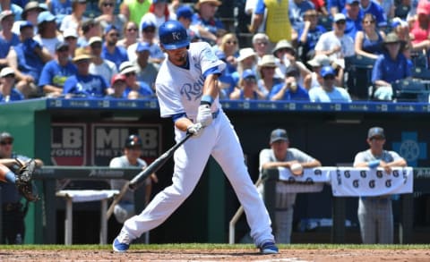 Jun 19, 2016; Kansas City, MO, USA; Kansas City Royals left fielder Brett Eibner (12) connects for a one run sacrifice grounder in the fifth inning against the Detroit Tigers at Kauffman Stadium. Mandatory Credit: Denny Medley-USA TODAY Sports