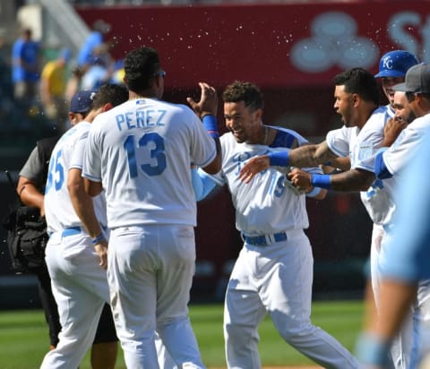 Jun 19, 2016; Kansas City, MO, USA; Kansas City Royals third baseman Cheslor Cuthbert (19) celebrate with teammates after the game winning walk off single in the thirteenth inning over the Detroit Tigers at Kauffman Stadium. The Royals won 2-1. Mandatory Credit: Denny Medley-USA TODAY Sports