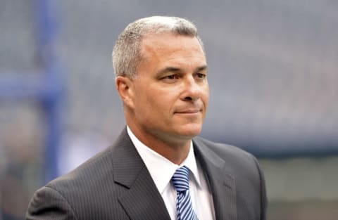 Apr 6, 2015; Kansas City, MO, USA; Kansas City Royals general manager Dayton Moore walks on the field before the game against the Chicago White Sox at Kauffman Stadium. Mandatory Credit: Denny Medley-USA TODAY Sports