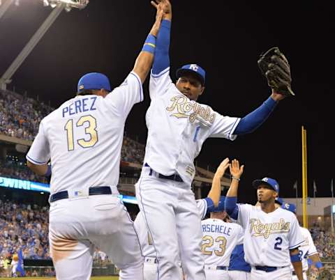 Jun 17, 2016; Kansas City, MO, USA; Kansas City Royals catcher Salvador Perez (13) and right fielder Jarrod Dyson (1) celebrate after a win over the Detroit Tigers at Kauffman Stadium. The Royals won 10-3. Mandatory Credit: Denny Medley-USA TODAY Sports