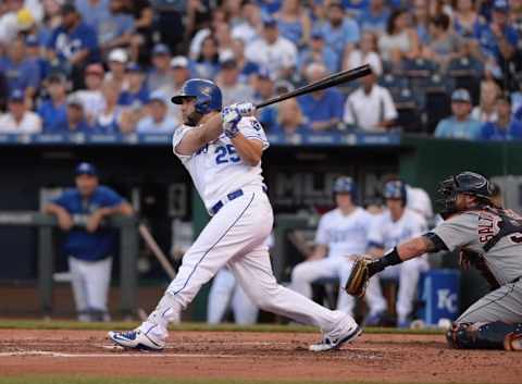 Jun 17, 2016; Kansas City, MO, USA; Kansas City Royals designated hitter Kendrys Morales (25) is congratulated in the dugout after hitting a three run home run in the eighth inning against the Detroit Tigers at Kauffman Stadium. The Royals won 10-3. Mandatory Credit: Denny Medley-USA TODAY Sports