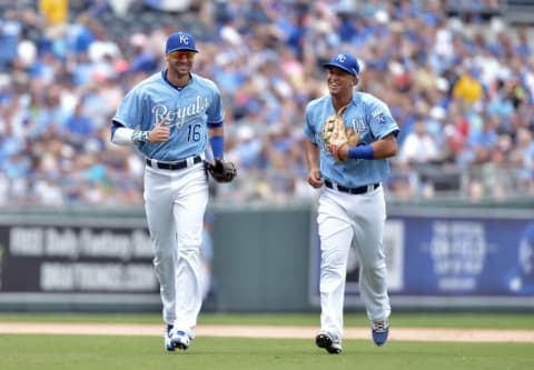 Jul 9, 2015; Kansas City, MO, USA; Kansas City Royals right fielder Paulo Orlando (16) and third baseman Cheslor Cuthbert (19) celebrate on the way to the dugout after the eighth inning against the Tampa Bay Rays at Kauffman Stadium. The Royals won 8-3. Mandatory Credit: Denny Medley-USA TODAY Sports