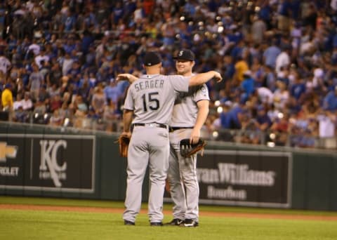 Jul 8, 2016; Kansas City, MO, USA; Seattle Mariners third baseman Kyle Seager (15) celebrates with first baseman Adam Lind (26) after the game against the Kansas City Royals at Kauffman Stadium. Seattle won 3-2. Mandatory Credit: John Rieger-USA TODAY Sports