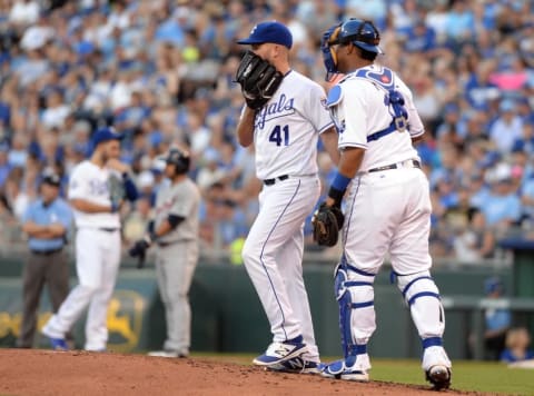 Jun 16, 2016; Kansas City, MO, USA; Kansas City Royals catcher Salvador Perez (13) talks to starting pitcher Danny Duffy (41) against the Detroit Tigers in the third inning at Kauffman Stadium. Mandatory Credit: John Rieger-USA TODAY Sports