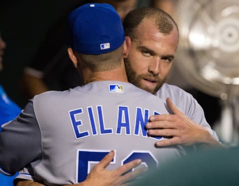 Jul 2, 2016; Philadelphia, PA, USA; Kansas City Royals relief pitcher Danny Duffy (41) hugs pitching coach Dave Eiland (58) in the dugout after being relieved in the ninth inning against the Philadelphia Phillies at Citizens Bank Park. The Kansas City Royals won 6-2. Mandatory Credit: Bill Streicher-USA TODAY Sports