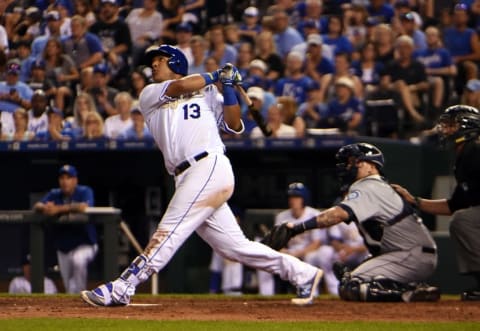 Jul 8, 2016; Kansas City, MO, USA; Kansas City Royals catcher Salvador Perez (13) hits a home run against the Seattle Mariners in the ninth inning at Kauffman Stadium. Seattle won 3-2. Mandatory Credit: John Rieger-USA TODAY Sports