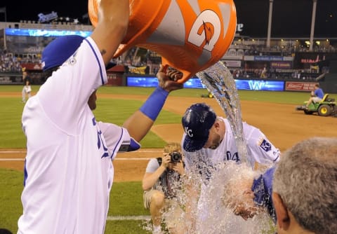 Aug 11, 2016; Kansas City, MO, USA; Kansas City Royals catcher Salvador Perez (13) dumps the water cooler on starting pitcher Danny Duffy (41) after the game against the Chicago White Sox at Kauffman Stadium. Kansas City won the game 2-1. Mandatory Credit: John Rieger-USA TODAY Sports