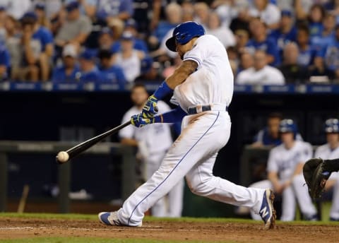 Aug 18, 2016; Kansas City, MO, USA; Kansas City Royals third baseman Cheslor Cuthbert (19) hits a double against the Minnesota Twins in the eighth inning at Kauffman Stadium. Kansas City won the game 8-1. Mandatory Credit: John Rieger-USA TODAY Sports