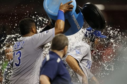 Aug 28, 2016; Boston, MA, USA; KC Royals catcher Salvador Perez (13) dumps the powerade bucket on first baseman Eric Hosmer (35) after defeating the Boston Red Sox 10-4 at Fenway Park. Mandatory Credit: Greg M. Cooper-USA TODAY Sports