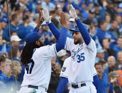 Oct 9, 2015; Kansas City, MO, USA; Kansas City Royals first baseman Eric Hosmer (35) celebrates with starting pitcher Johnny Cueto (47) after scoring a run against the Houston Astros in the 6th inning in game two of the ALDS at Kauffman Stadium. Mandatory Credit: Peter G. Aiken-USA TODAY Sports