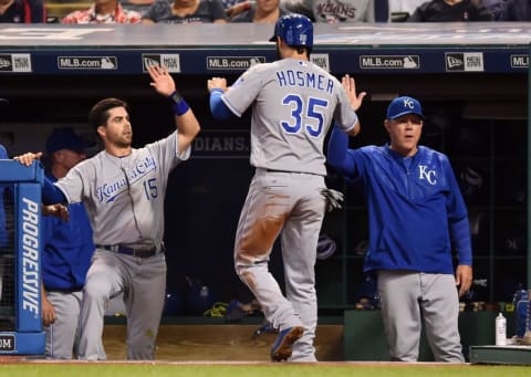 Sep 21, 2016; Cleveland, OH, USA; Kansas City Royals first baseman Eric Hosmer (35) celebrates with second baseman Whit Merrifield (15) and manager Ned Yost (3) after scoring a run during the third inning against the Cleveland Indians at Progressive Field. Mandatory Credit: Ken Blaze-USA TODAY Sports