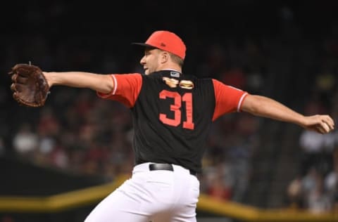 PHOENIX, AZ – AUGUST 26: Brad Boxberger #31 of the Arizona Diamondbacks delivers a pitch in the ninth inning of the MLB game against the Seattle Mariners at Chase Field on August 26, 2018 in Phoenix, Arizona. All players across MLB wear nicknames on their backs as well as colorful, non-traditional uniforms featuring alternate designs inspired by youth-league uniforms during Players Weekend. The Arizona Diamondbacks won 5-2. (Photo by Jennifer Stewart/Getty Images)