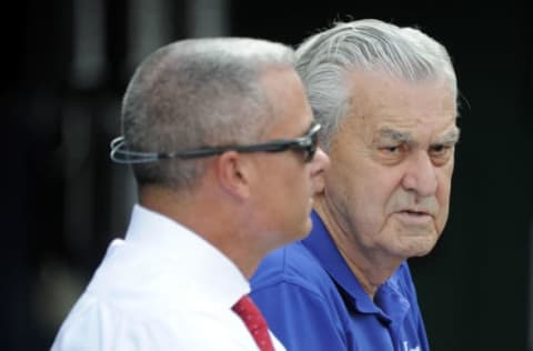 KANSAS CITY, MO – AUGUST 9: Kansas City Royals’ owner David Glass talks with general manager Dayton Moore as they watch the Royals take batting practice prior to a game against the Chicago White Sox at Kauffman Stadium on August 9, 2016 in Kansas City, Missouri. (Photo by Ed Zurga/Getty Images)