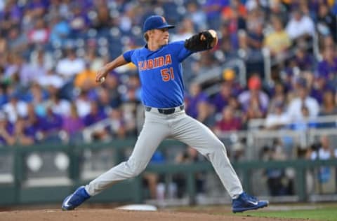 Omaha, NE – JUNE 26: Pitcher Brady Singer #51 of the Florida Gators delivers a pitch against the LSU Tigers in the first inning during game one of the College World Series Championship Series on June 26, 2017 at TD Ameritrade Park in Omaha, Nebraska. (Photo by Peter Aiken/Getty Images)