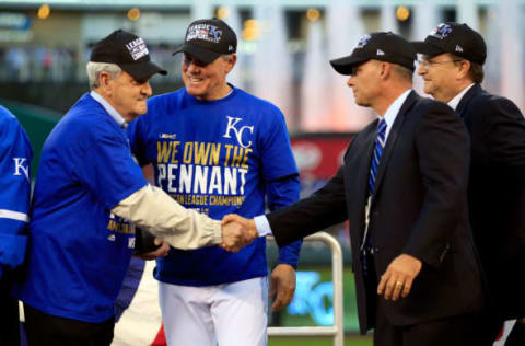 KANSAS CITY, MO – OCTOBER 15: David Glass, Owner and Chief Executive Officer of the Kansas City Royals, celebrates with manager Ned Yost