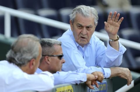 KANSAS CITY, MO – JUNE 13: David Glass owner of the Kansas City Royals talks with Dan Glass president and Dayton Moore general manager before an interleague game against the Milwaukee Brewers at Kauffman Stadium on June 13, 2012 in Kansas City, Missouri. (Photo by Ed Zurga/Getty Images)