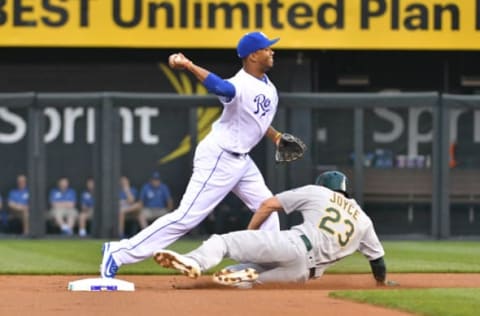 Apr 12, 2017; Kansas City, MO, USA; Kansas City Royals shortstop Alcides Escobar (2) forces out Oakland Athletics right fielder Matt Joyce (23) at second base and throws to first for a double play in the first inning at Kauffman Stadium. Mandatory Credit: Denny Medley-USA TODAY Sports