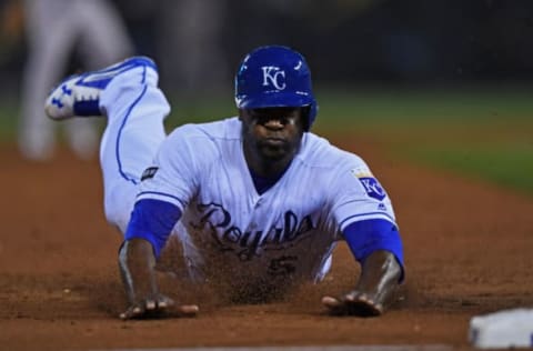 Apr 13, 2017; Kansas City, MO, USA; Kansas City Royals base runner Lorenzo Cain (6) dives head first into third base for a stolen base against the Oakland Athletics during the third inning at Kauffman Stadium. Mandatory Credit: Peter G. Aiken-USA TODAY Sports