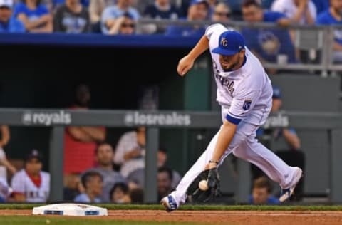 Apr 15, 2017; Kansas City, MO, USA; Kansas City Royals third basemen Mike Moustakas fields a ground ball against the Los Angeles Angels during the fifth inning at Kauffman Stadium. Mandatory Credit: Peter G. Aiken-USA TODAY Sports