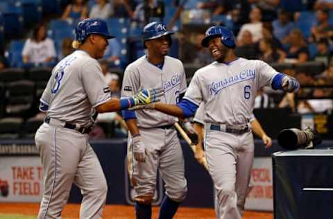 May 8, 2017; St. Petersburg, FL, USA; Kansas City Royals center fielder Lorenzo Cain (6) is congratulated by designated hitter Salvador Perez (13) and shortstop Alcides Escobar (2) after he hit a in the park 2-RBI home run during the third inning against the Tampa Bay Rays at Tropicana Field. Mandatory Credit: Kim Klement-USA TODAY Sports