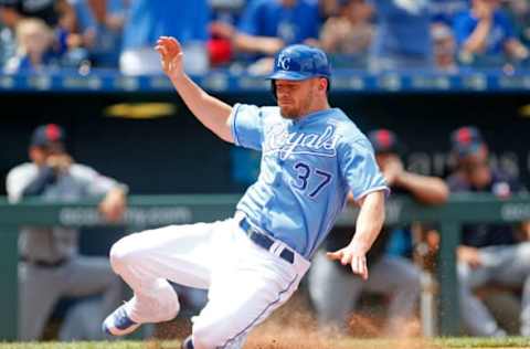 Jun 3, 2017; Kansas City, MO, USA; Kansas City Royals designated hitter Brandon Moss (37) slides into home plate in the fifth inning of the game against the Cleveland Indians at Kauffman Stadium. The Royals won 12-5. Mandatory Credit: Jay Biggerstaff-USA TODAY Sports