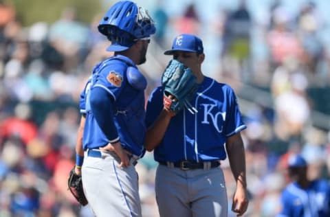 Mar 11, 2017; Goodyear, AZ, USA; Kansas City Royals catcher Cam Gallagher (36) talks with Kansas City Royals starting pitcher Jason Vargas (51) during the second inning against the Cleveland Indians at Goodyear Ballpark. Mandatory Credit: Joe Camporeale-USA TODAY Sports