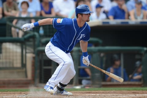 Mar 5, 2016; Surprise, AZ, USA; Kansas City Royals center fielder Bubba Starling (11) runs to first base after hitting a pitch in the second inning against the Chicago White Sox at Surprise Stadium. Mandatory Credit: Joe Camporeale-USA TODAY Sports