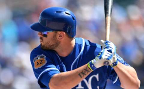 Mar 18, 2017; Surprise, AZ, USA; Kansas City Royals third baseman Mike Moustakas (8) at bat during the first inning against the Cleveland Indians at Surprise Stadium. Mandatory Credit: Jake Roth-USA TODAY Sports