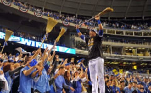 Oct 5, 2014; Kansas City, MO, USA; Kansas City Royals catcher Salvador Perez (13) celebrates with fans after defeating the Los Angeles Angels in game three of the 2014 ALDS baseball playoff game at Kauffman Stadium. The Royals won 8-4 advancing to the ALCS against the Baltimore Orioles. Mandatory Credit: Peter G. Aiken-USA TODAY Sports