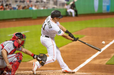 MIAMI, FL – JULY 26: J.T. Realmuto #11 of the Miami Marlins doubles for an rbi in the first inning against the Washington Nationals at Marlins Park on July 26, 2018 in Miami, Florida. (Photo by Mark Brown/Getty Images)