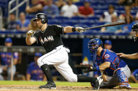 MIAMI, FL – AUGUST 11: Bryan Holaday #28 of the Miami Marlins hits a walk-off single in the eleventh inning to defeat the New York Mets 4-3 at Marlins Park on August 11, 2018 in Miami, Florida. (Photo by Michael Reaves/Getty Images)