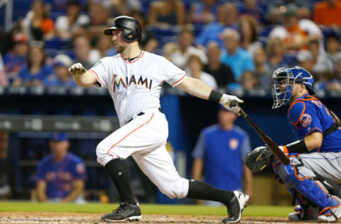 MIAMI, FL – AUGUST 12: Bryan Holaday #28 of the Miami Marlins hits a RBI single in the fourth inning against the New York Mets at Marlins Park on August 12, 2018 in Miami, Florida. (Photo by Michael Reaves/Getty Images)