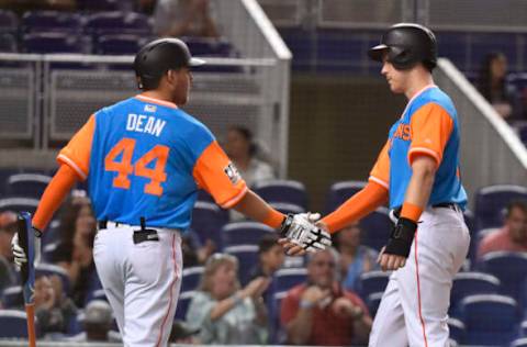 MIAMI, FL – AUGUST 24: Austin Dean #44 of the Miami Marlins congratulates Brian Anderson #15 after scoring in the fourth inning of the game against the Atlanta Braves at Marlins Park on August 24, 2018 in Miami, Florida. (Photo by Eric Espada/Getty Images)