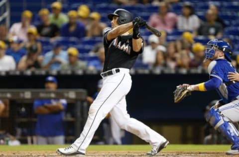 MIAMI, FL – SEPTEMBER 01: J.T. Realmuto #11 of the Miami Marlins hits a solo home run in the third inning against the Toronto Blue Jays at Marlins Park on September 1, 2018 in Miami, Florida. (Photo by Michael Reaves/Getty Images)