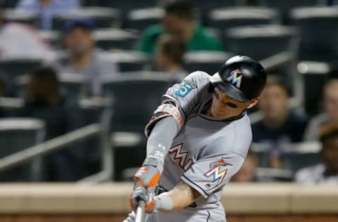 NEW YORK, NY – SEPTEMBER 11: Derek Dietrich #32 of the Miami Marlins connects on a ninth inning RBI double against the New York Mets at Citi Field on September 11, 2018 in the Flushing neighborhood of the Queens borough of New York City. (Photo by Jim McIsaac/Getty Images)