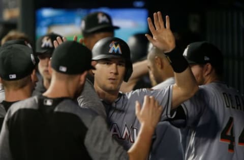 NEW YORK, NY – SEPTEMBER 11: J.T. Realmuto #11 of the Miami Marlins celebrates with his teammates in the dugout after scoring a run in the ninth inning against the Miami Marlins at Citi Field on September 11, 2018 in the Flushing neighborhood of the Queens borough of New York City. (Photo by Jim McIsaac/Getty Images)