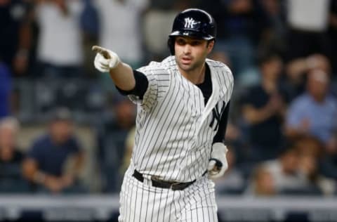 NEW YORK, NY – SEPTEMBER 18: Neil Walker #14 of the New York Yankees reacts after his seventh inning three run home run against the Boston Red Sox at Yankee Stadium on September 18, 2018 in the Bronx borough of New York City. (Photo by Jim McIsaac/Getty Images)