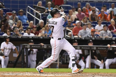 MIAMI, FL – SEPTEMBER 23: Chad Wallach #17 of the Miami Marlins hits a home run in the third inning against the Cincinnati Reds at Marlins Park on September 23, 2018 in Miami, Florida. (Photo by Eric Espada/Getty Images)