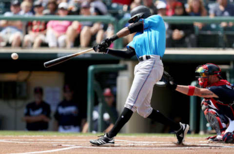 LAKE BUENA VISTA, FLORIDA – MARCH 03: Rossell Herrera #5 of the Miami Marlins hits a single in the first inning against the Atlanta Braves during the Grapefruit League spring training game at Champion Stadium on March 03, 2019 in Lake Buena Vista, Florida. (Photo by Dylan Buell/Getty Images)