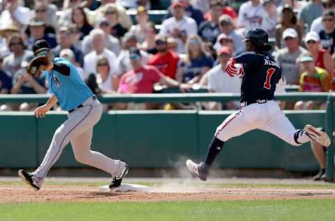 LAKE BUENA VISTA, FLORIDA – MARCH 03: Neil Walker #18 of the Miami Marlins forces out Ozzie Albies #1 of the Atlanta Braves at first base in the third inning during the Grapefruit League spring training game at Champion Stadium on March 03, 2019 in Lake Buena Vista, Florida. (Photo by Dylan Buell/Getty Images)