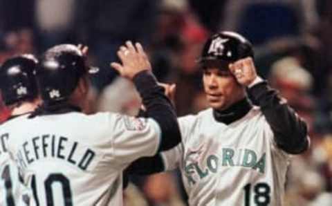 Florida Marlins Moises Alou (R) is congratulated by Gary Sheffield after his three-run home run in the sixth inning against the Cleveland Indians in game five of the World Series 23 October at Jacobs Field in Cleveland, OH. AFP PHOTO/JEFF HAYNES (Photo by JEFF HAYNES / AFP) (Photo credit should read JEFF HAYNES/AFP via Getty Images)