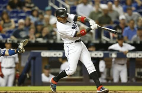 MIAMI, FLORIDA – APRIL 01: Starlin Castro #13 of the Miami Marlins hits an RBI single in the sixth inning against the New York Mets at Marlins Park on April 01, 2019 in Miami, Florida. (Photo by Michael Reaves/Getty Images)