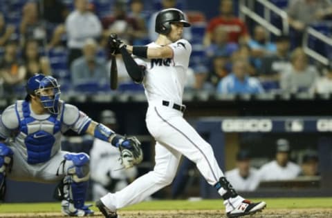 MIAMI, FLORIDA – APRIL 02: JT Riddle #10 of the Miami Marlins hits an RBI ground out in the eighth inning against the New York Mets at Marlins Park on April 02, 2019 in Miami, Florida. (Photo by Michael Reaves/Getty Images)