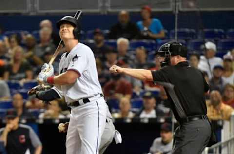 MIAMI, FL – APRIL 30: Garrett Cooper #26 of the Miami Marlins reacts after striking out in the second inning against the Cleveland Indians at Marlins Park on April 30, 2019 in Miami, Florida. (Photo by Eric Espada/Getty Images)