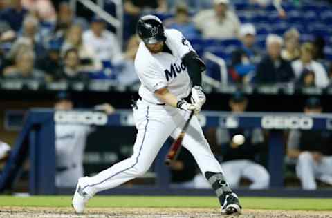 MIAMI, FLORIDA – APRIL 16: Austin Dean #44 of the Miami Marlins doubles in the seventh inning against the Chicago Cubs at Marlins Park on April 16, 2019 in Miami, Florida. (Photo by Michael Reaves/Getty Images)