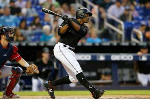 MIAMI, FLORIDA – APRIL 20: Curtis Granderson #21 of the Miami Marlins hits a solo home run in the fifth inning against the Washington Nationals at Marlins Park on April 20, 2019 in Miami, Florida. (Photo by Michael Reaves/Getty Images)